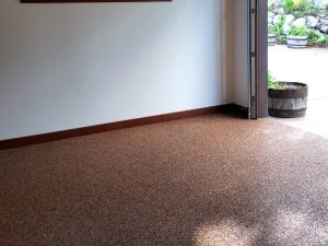 a open garage with floor made of epoxy flooring