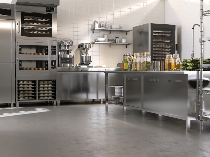 Durable commercial kitchen flooring materials, showcasing various options like vinyl, epoxy, and tile.