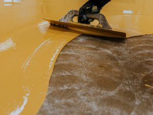 Transforming concrete floors with the best epoxy floor paint for a vibrant, easy-to-clean surface.