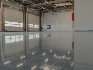 High-gloss decorative epoxy resin flooring creates a durable and stylish surface in a commercial space.